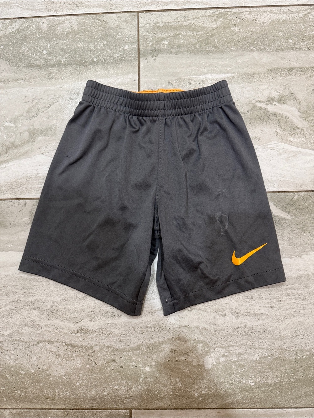 Nike Black Athletic Shorts with Orange Swoosh Accent